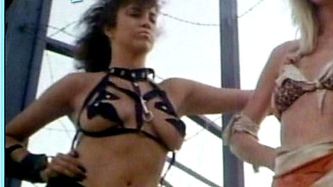 Pic: Dusty Woods in She-Wolves of the Wasteland (1987)